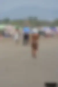 Tattooed blonde with big tits topless and in thong