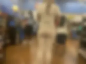 Sexy ebony babe with a nice ass in leggings waiting in line