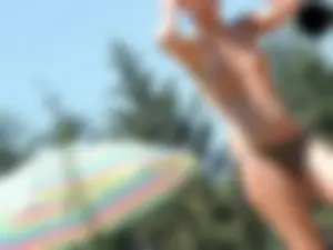 Cheetah thong wearing topless milf at the pool