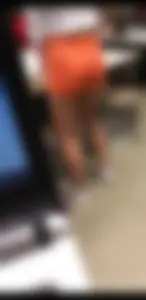 Ass hugging orange shorts