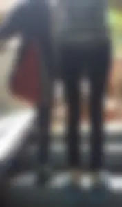 Slim Legs in Tight Black Jeans, Girl in Sneakers on an Escalator Creepshot