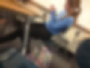 Adorable college teen sitting in class bored