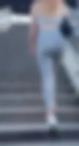 Skinny girl in super thin grey pants upstairs