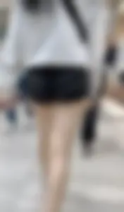 Asian girl in tight black shorts at the mall