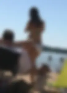 Swedish beach blonde girl in white and green bikini
