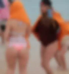 Couple PAWGs on the beach in bikinis partying