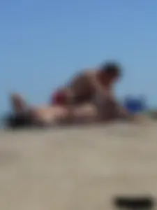 Purple thong topless lady on the beach gets oiled up by her husband