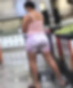 Thick Latina babe with a nice ass in tight patterned shorts