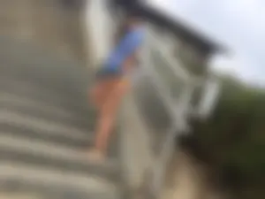 Blue thong beach babe walking up the stairs