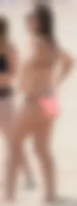 Girl in peach bikini on the beach with a great body and great ass