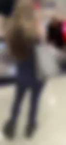 Pregnant blonde girl in leggings at the airport