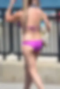 Sexy thick blonde girl in purple bikini