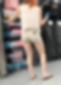 Redhead hottie in shorts shopping with a nice ass