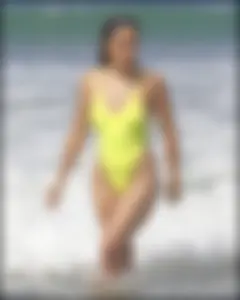 Sexy ass beach babe in a yellow thong swimsuit
