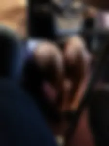 Milf's legs in a skirt closeup