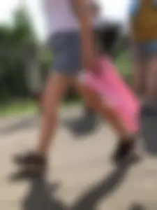 Cute Girl in Denim Shorts Walking Down a Railway Station Gallery
