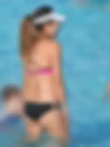 Asian milf in black and pink bikini at the beach