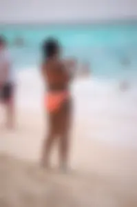 Assortment of sexy babes at the beach in bikinis
