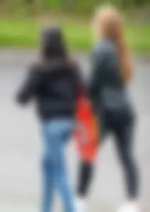 Redhead and ethnic skinny teens in tight jeans