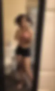 Nice curly-haired girl mirror selfies