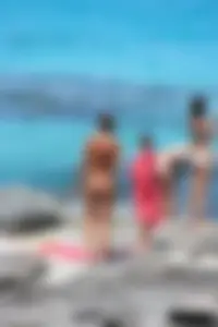 Older lady on a nude beach showing her body