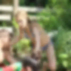 Sexy girl at the pool in a bikini with great tits