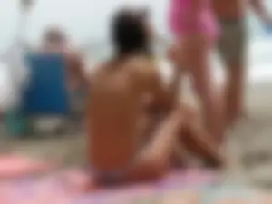 Hot topless girl on the beach in a thong bikini with a nice ass
