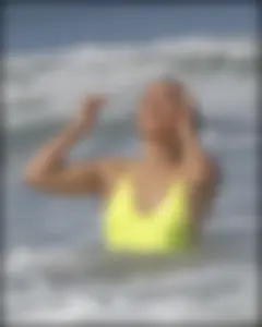 Sexy ass beach babe in a yellow thong swimsuit