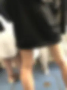 Blonde in a Dress and Sneakers With Sexy Skinny Legs in the Subway Train and on the Escalator Closeup Candid Photos