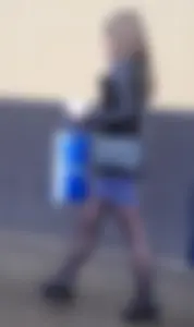 Hot girl wearing a skirt, leather jacket and black pantyhose street creepshot - hot skinny legs