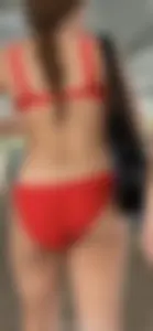 Beauty picks at her bikini wedgie