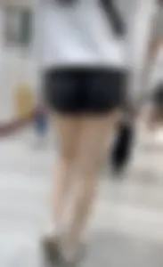 Asian girl in tight black shorts at the mall