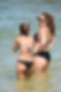 Sexy group of girls on the beach in various sizes