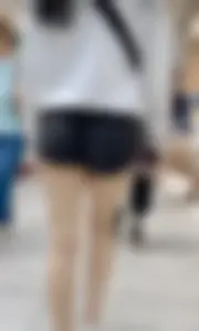 Asian girl in tight black shorts at the mall