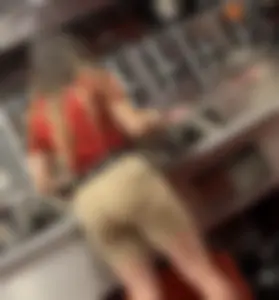Slim Thick Wavy Haired Cutie Bends Over in Tight Shorts