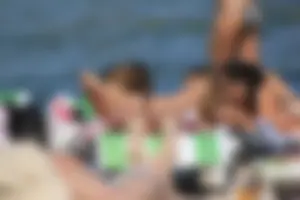 A couple sexy girls laying out on the beach