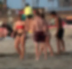 Thick white girls ass in a black thong bikini at the beach