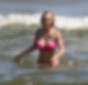 Two sexy beach teens in bikinis, one thick and one skinny with big boobs