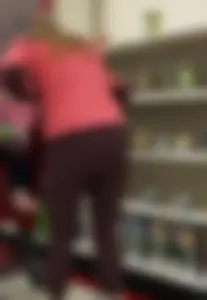 Target milf with a decent ass in maroon leggings