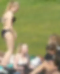 Teen taking off her dress in the park