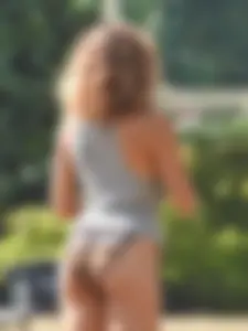 Lady at the park stripping down to her bikini to lay out