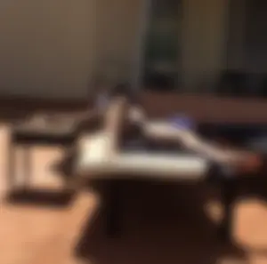 Blonde laying out in a blue bikini with a sexy body