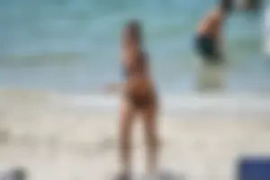 Sexy ass girl with a perfect body in her bikini on the beach