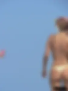 Sexy girls going topless at the beach showing off their sexy bodies