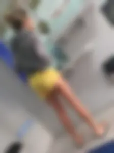 Skinny ass eating her yellow shorts