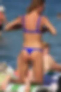 A couple sexy girls laying out on the beach