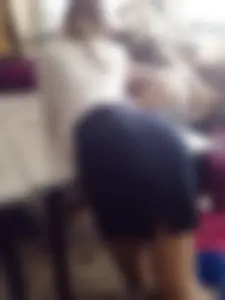 College Teen in a Skirt Bend Over Desk in Classroom