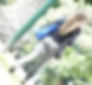 Tight bum walking through the park