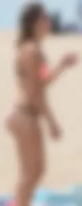 Girl in peach bikini on the beach with a great body and great ass