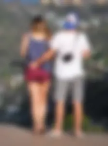 Girl in short maroon shorts with decent booty